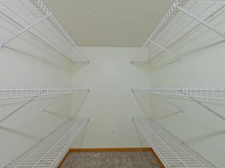 Empty white shelves in a room.