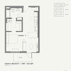 A black and white drawing of a studio apartment layout.