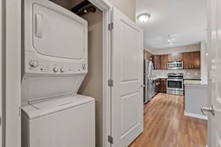 A white oven and dishwasher in a kitchen.