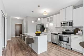 Kitchen and dining area in the Glaze Floor Plan at Galante at Parkside in Apple Valley, MN
