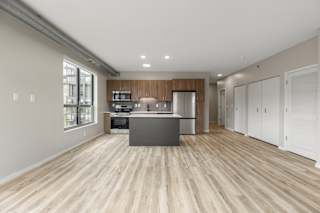 Kitchen and living room in the CC2 Floor Plan at The Ellory Apartments, Minnesota, 55401