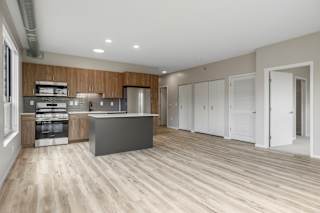 Kitchen and living room in the CC2 Floor Plan at The Ellory Apartments, Minnesota, 55401