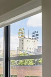 View out the window in the primary Bedroom in the CC2 Floor Plan at The Ellory Apartments, Minnesota, 55401