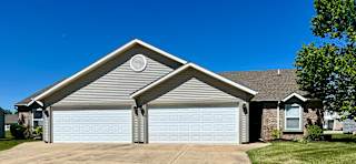 a white garage door in front of a house at Shenandoah Properties in Lafayette, IN 47905