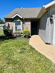 a house with a sidewalk in front of it at Shenandoah Properties in Lafayette, IN 47905