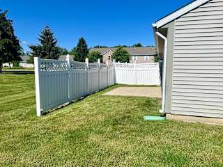 a yard with a fence and a house at Shenandoah Properties in Lafayette, IN 47905