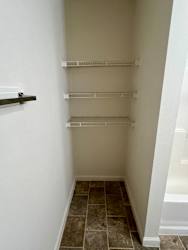 a walk in closet with empty shelves at Shenandoah Properties in Lafayette, IN 47905