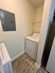 a small laundry room with a washer and dryer at Shenandoah Properties in Lafayette, IN 47905