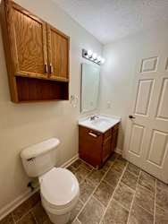 a bathroom with a toilet and a sink at Shenandoah Properties in Lafayette, IN 47905