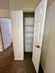 an empty closet in a home with a door open at Shenandoah Properties in Lafayette, IN 47905
