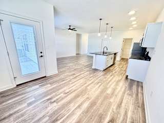 A spacious kitchen with a white countertop and a ceiling fan.at Concord Crossing, Lafayette, IN 47909