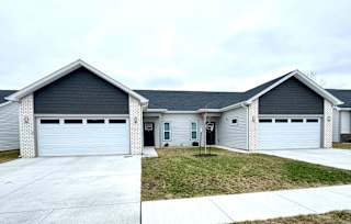 A two-story house with a garage on each floor.at Concord Crossing, Lafayette, IN 47909