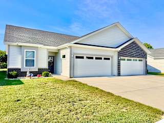 A two-car garage is attached to a house.