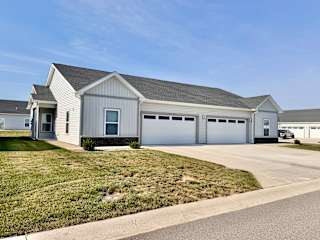 A two-car garage is attached to a house.