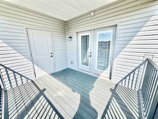 A white door is on the left and a glass door is on the right.