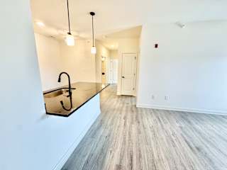 A modern kitchen with a sink and a countertop.