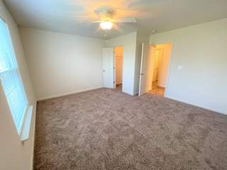 Wooden interior flooring in bedroom at Hawthorne Properties, Lafayette, IN 47905