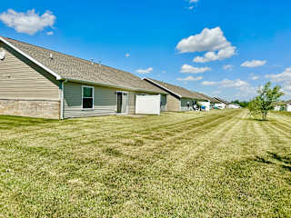 a row of houses with grass in front of them at Hawthorne Properties in Lafayette, IN 47905