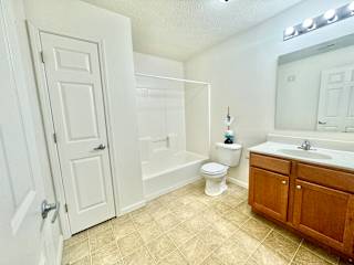 a bathroom with a sink toilet and a shower at Hawthorne Properties in Lafayette, IN 47905