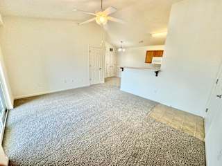 the living room of an empty house with a ceiling fan at Hawthorne Properties in Lafayette, IN 47905