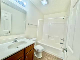 bathroom with tub and shower and sink at Hawthorne Properties in Lafayette, IN 47905