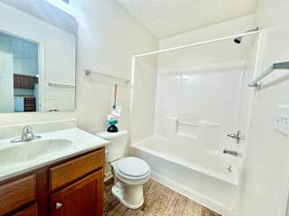 bathroom with tub sink and toilet at Hawthorne Properties in Lafayette, IN 47905