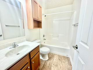 a bathroom with a sink toilet and a shower at Hawthorne Properties in Lafayette, IN 47905