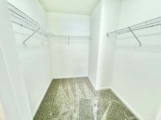 an empty closet with empty shelves in a room with white walls at Hawthorne Properties in Lafayette, IN 47905