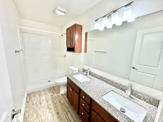 a bathroom with a sink and a toilet and a shower at Hawthorne Properties in Lafayette, IN 47905
