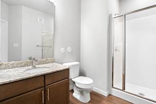 a bathroom with a shower toilet and sink and a mirror  at Aventura at Hawk Ridge, Lake St Louis, 63367