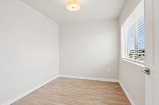 A room with a window and a door.
