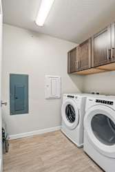 A laundry room with a washer and dryer.
