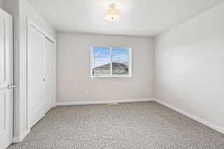 A room with a window and a door.