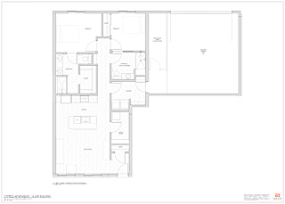 A floor plan of a building with multiple rooms and labeled areas.