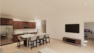 A modern kitchen with a dining table and chairs.