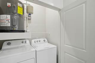 Laundry closet with side by side washer and dryer 3 at Cantarra Apartments, Manor