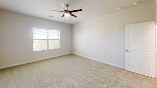 A room with a ceiling fan and a window. at Bridge at Speyside Apartments, Austin, TX, 78754