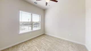 an empty room with a window and a ceiling fan at Bridge at Speyside Apartments, Texas