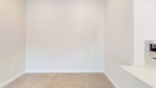A room with a carpeted floor and a white wall. at Bridge at Speyside Apartments, Austin, Texas
