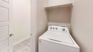 the washer and dryer in the laundry room of a home at Bridge at Speyside Apartments, Texas, 78754