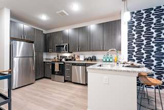 the heights on capitol hill apartments kitchen with stainless steel appliances at Avery Ranch, Austin Texas