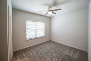 a bedroom with a ceiling fan and a window at Avery Ranch, Texas, 78717