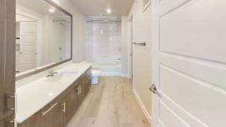 a bathroom with a sink and a toilet and a shower at Bridge at Speyside Apartments, Texas