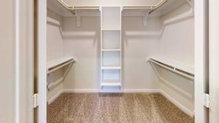 a empty walk in closet with empty shelves at Bridge at Speyside Apartments, Austin, TX, 78754