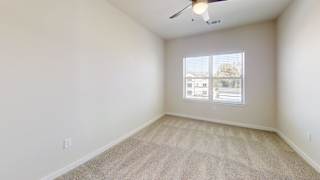 an empty room with a window and a ceiling fan at Bridge at Speyside Apartments, Austin