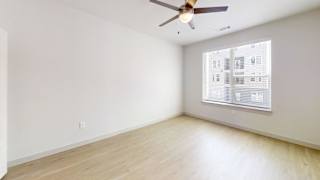 A room with a ceiling fan and a window with blinds. at ThreeTwenty at the Vybe Apartments, Texas, 78640