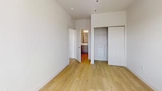 Empty bedroom with closet and hallway view at Matador Apartments, Austin, Texas