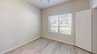 A room with a window and a door. at Bridge at Speyside Apartments, Austin, TX, 78754