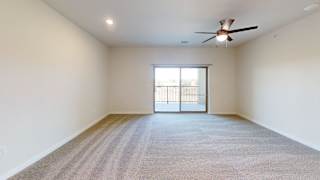A spacious room with a ceiling fan and carpeted floor. at Bridge at Speyside Apartments, Texas, 78754