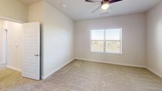 A room with a ceiling fan and a window with blinds. at Bridge at Speyside Apartments, Austin, 78754